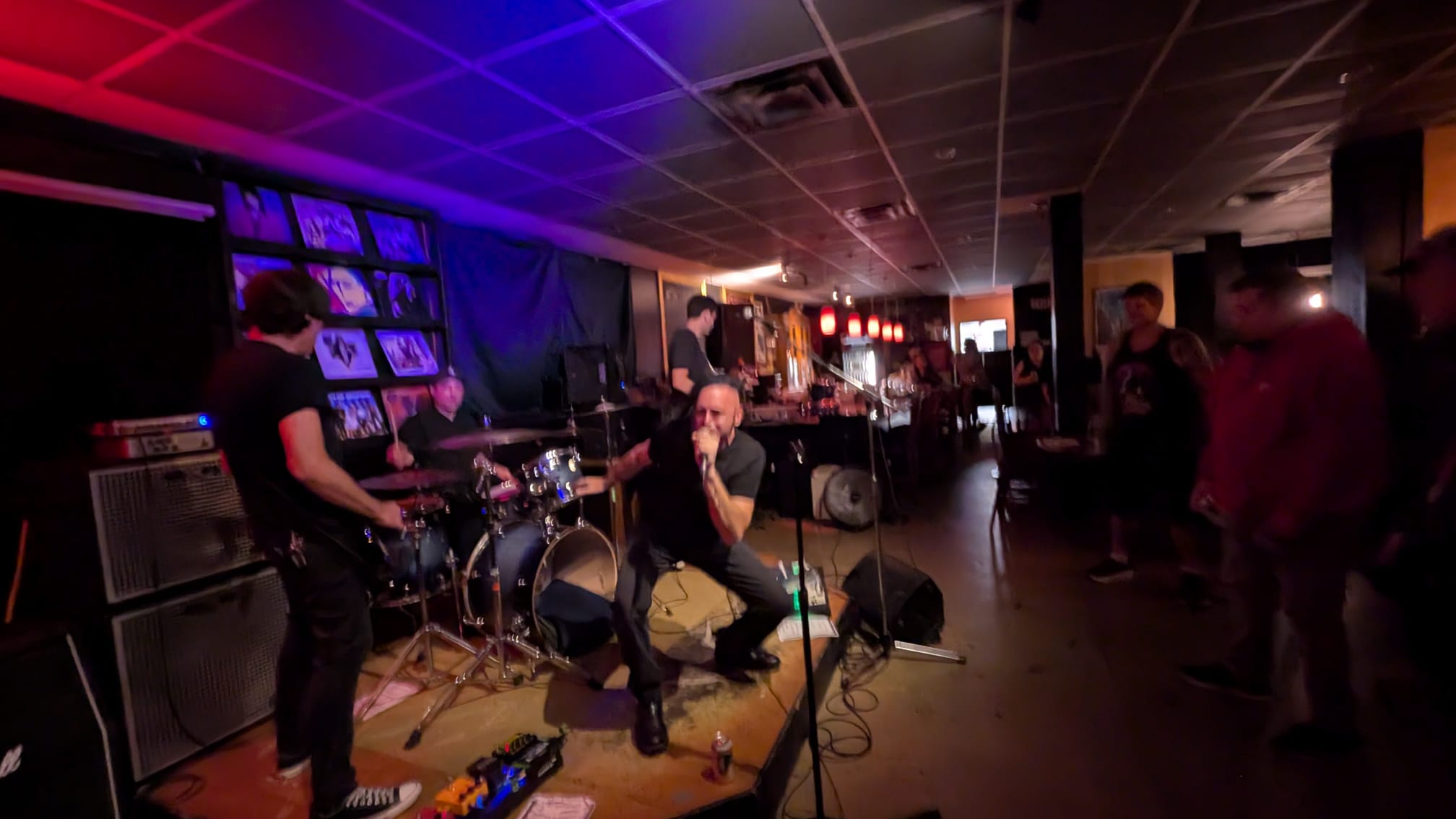 Granite performing live at a Vancouver venue, full band on stage with the crowd